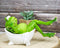 Green Frog with Golden Nails Soaking in Bath Tub While Daydreaming Figurine