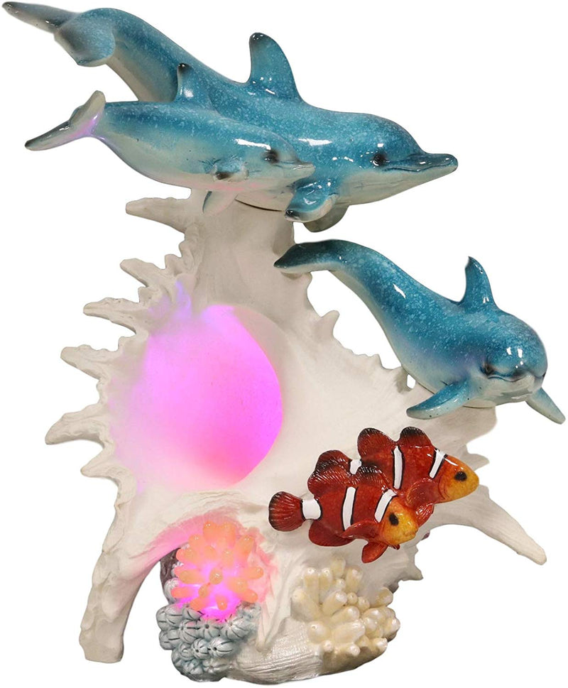 Ebros Nautical Ocean Family 3 Dolphins Swimming Over Giant Sea Conch Clownfishes and Anemones Statue with Colorful LED Light 9.5" Tall